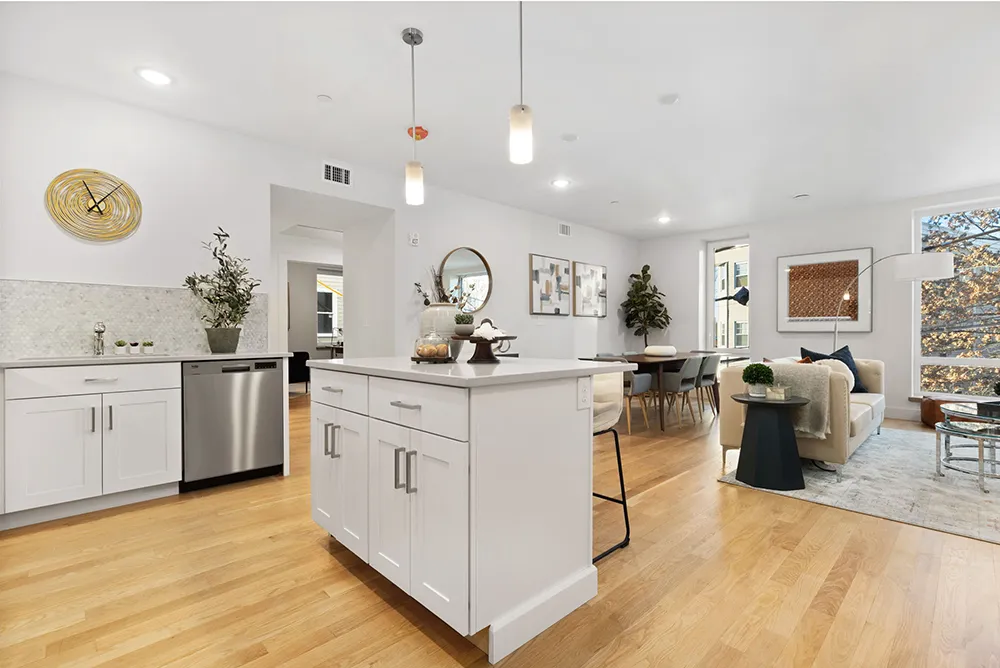 Open living space showing the kitchen, dining, and living area in 21 Wensley Street in Boston, MA